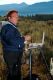 Susi in sagebrush field painting the Teton Mountains